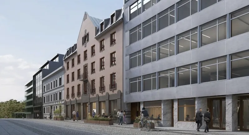 Øvre Vollgate 11: gateløp med eldre murgård og næringsbygg i lys betong