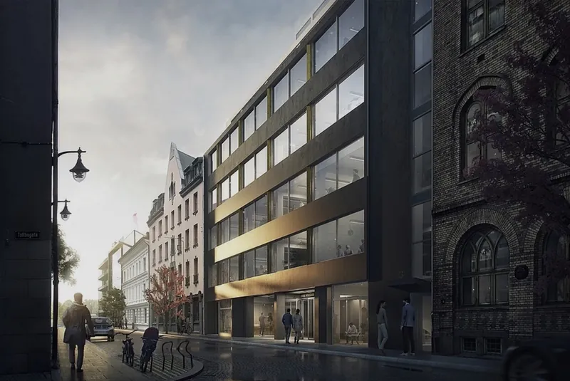 Øvre Vollgate 13: næringsbygg med mørk fasade og store vindusbånd i en bygate i Oslo sentrum